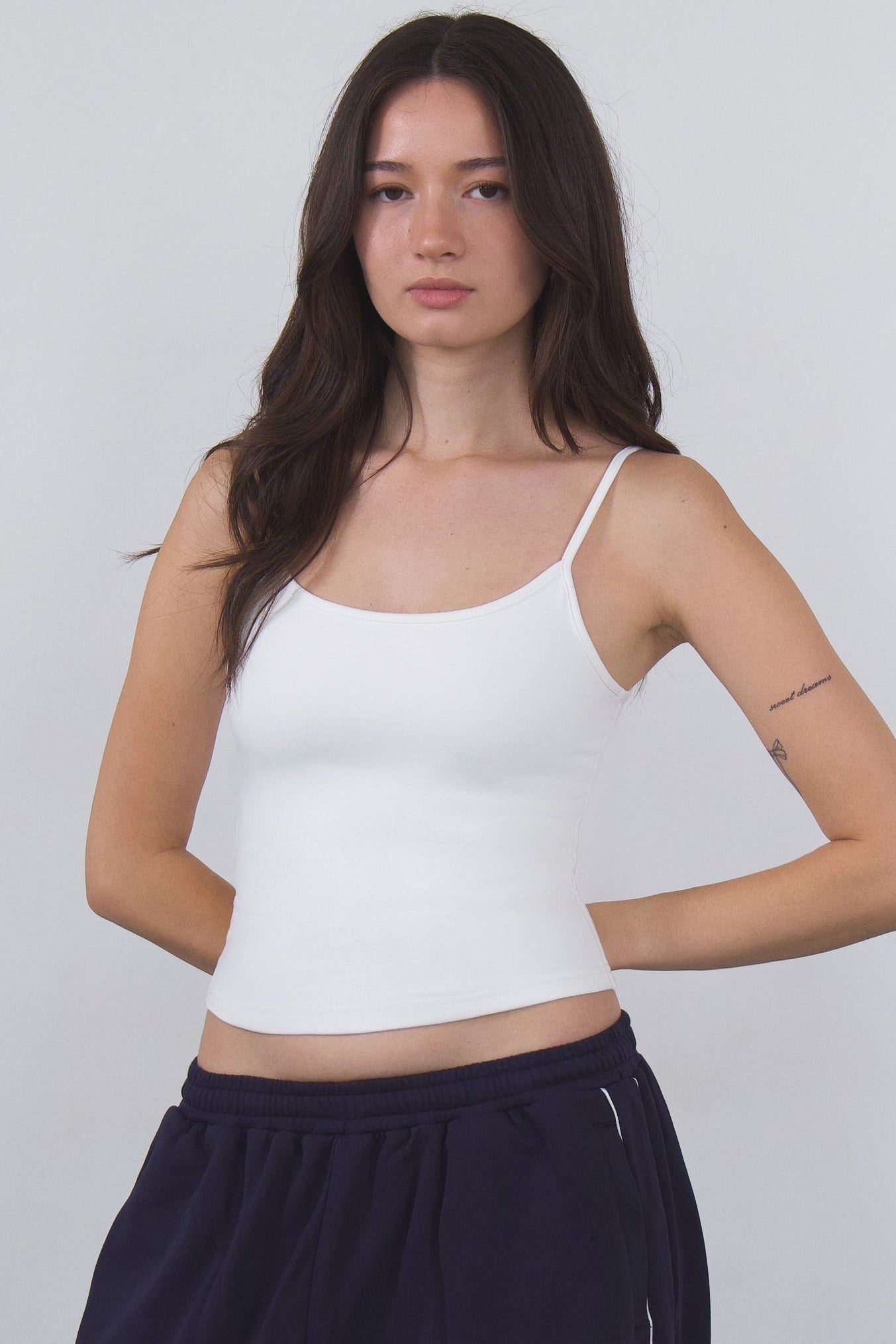 white compression tank top designed for studio training and everyday wear